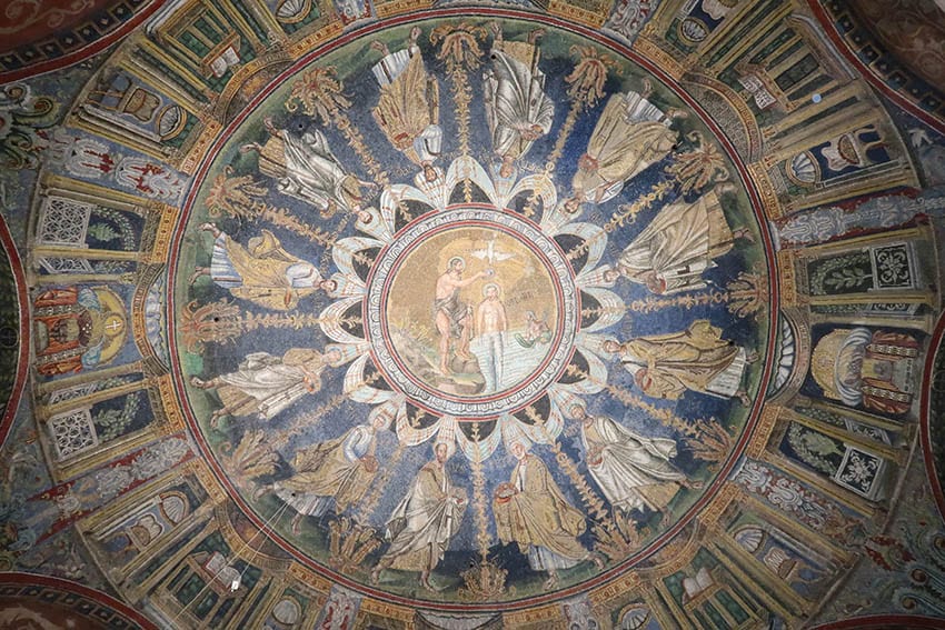 Ceiling of the Battistero Neonaino depicting Christ being baptised by John surrounded by Christ's apostles in Ravenna one of the UNESCO Heritage Sites in Italy