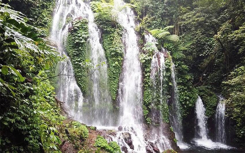 Banyumala waterfall in the North of Bali with 7 waterfalls surrounded by lush tropical vegetation