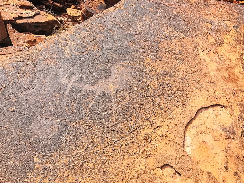 12 Amazing Unesco Heritage Sites In Africa 2 ochre rock with carving of a giraffe along with other carvings of circles