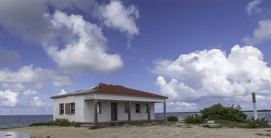Barbuda – What you Need to Know Before You Go 2 Derelict building in Barbuda with red roof and white walls