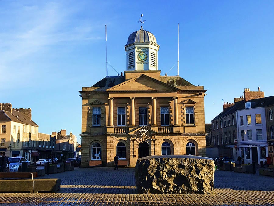Town hall in Kelso Scotland with Kelsae Stane public artwork in front of it