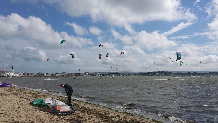 10+ of the Best Weekends in Dorset 10 sky over Poole beach filled with kitesurfers