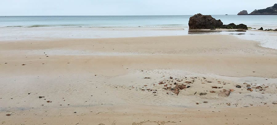 10+ of the Best Weekends in Devon 15 beach with sea coming in and rocks to the right at Westward Ho!