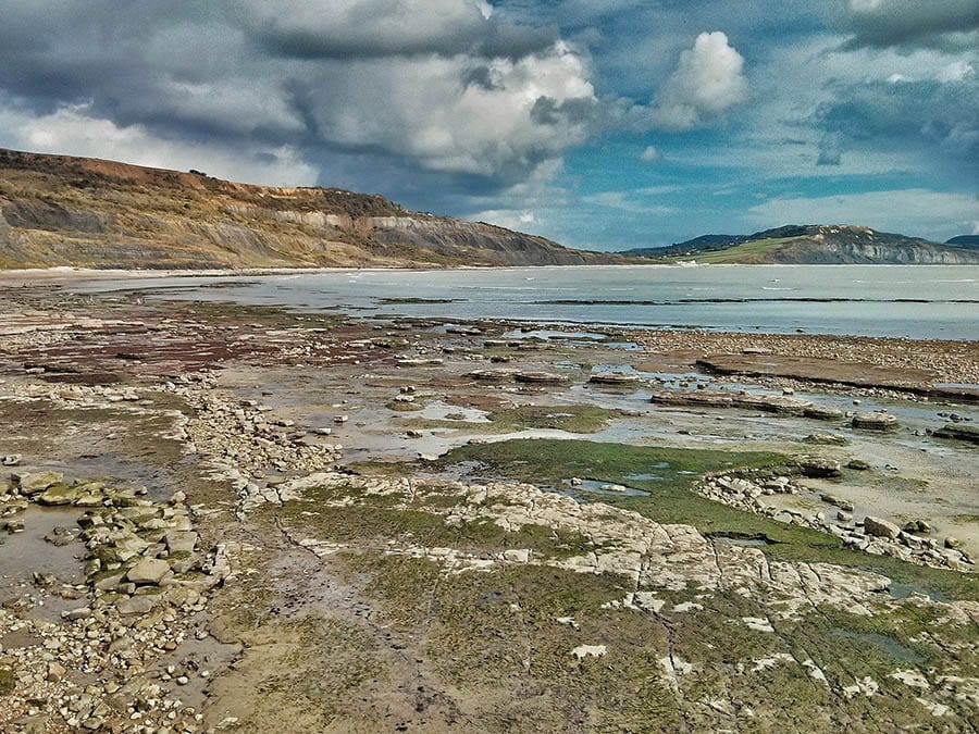 10+ of the Best Weekends in Dorset 5 Lyme Regis beach looking over rock pools towards the sea