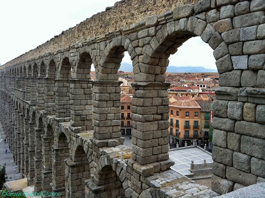 View of Segovia in Spain through the ruined arches of the