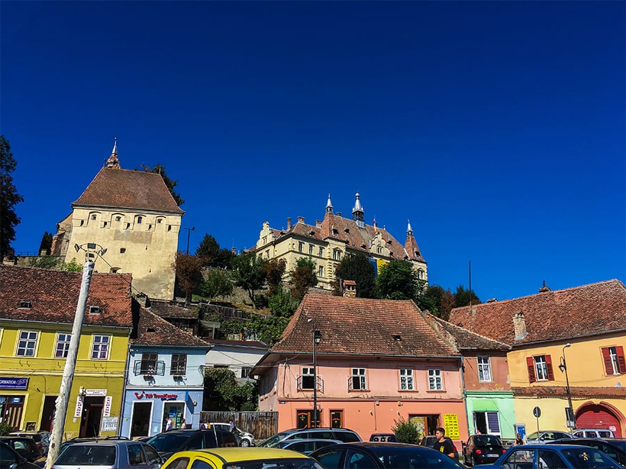 Colourful houses of yellow, blue and peach in a market squar
