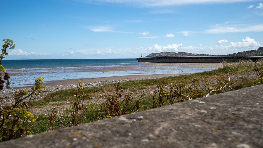 15+ Of The Best Things To Do On The Isle Of Man 8 Ramsey Beach with the pier in the background