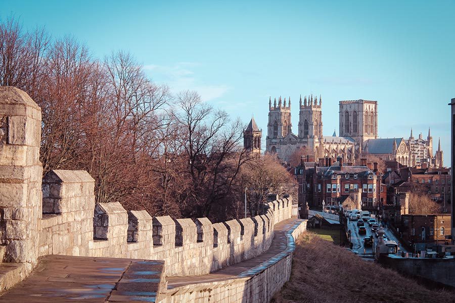 The Absolute Best Cities In The Uk To Visit With Map 12 castellated wall leading to York Cathedral