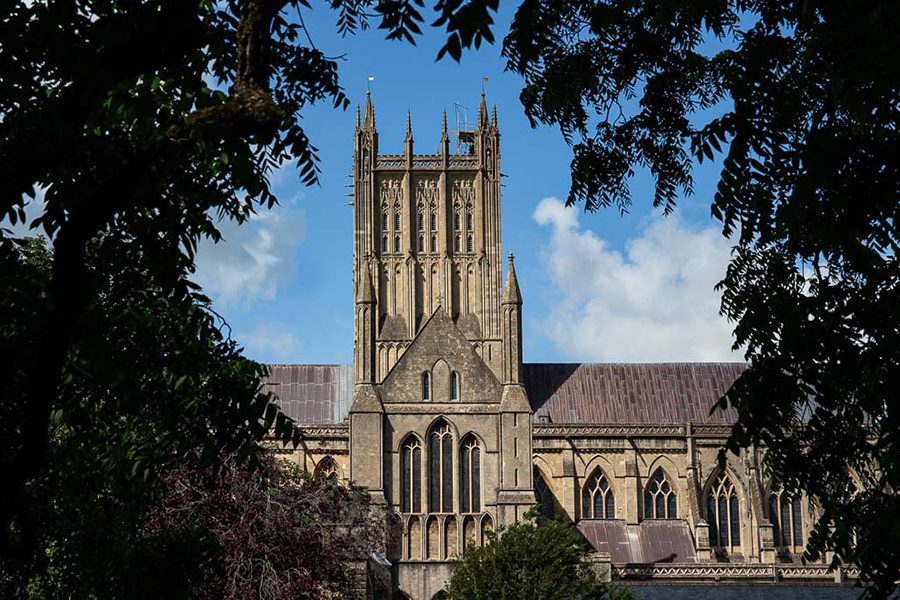 The Absolute Best Cities In The Uk To Visit With Map 14 View of Wells Cathedral through trees