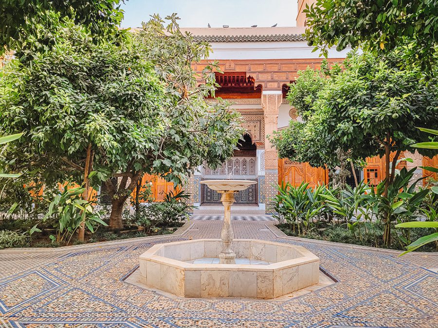25 Amazing Destinations for Winter Sun around the World 4 fountain with surrounded by blue and yellow tiles with ornate building behind