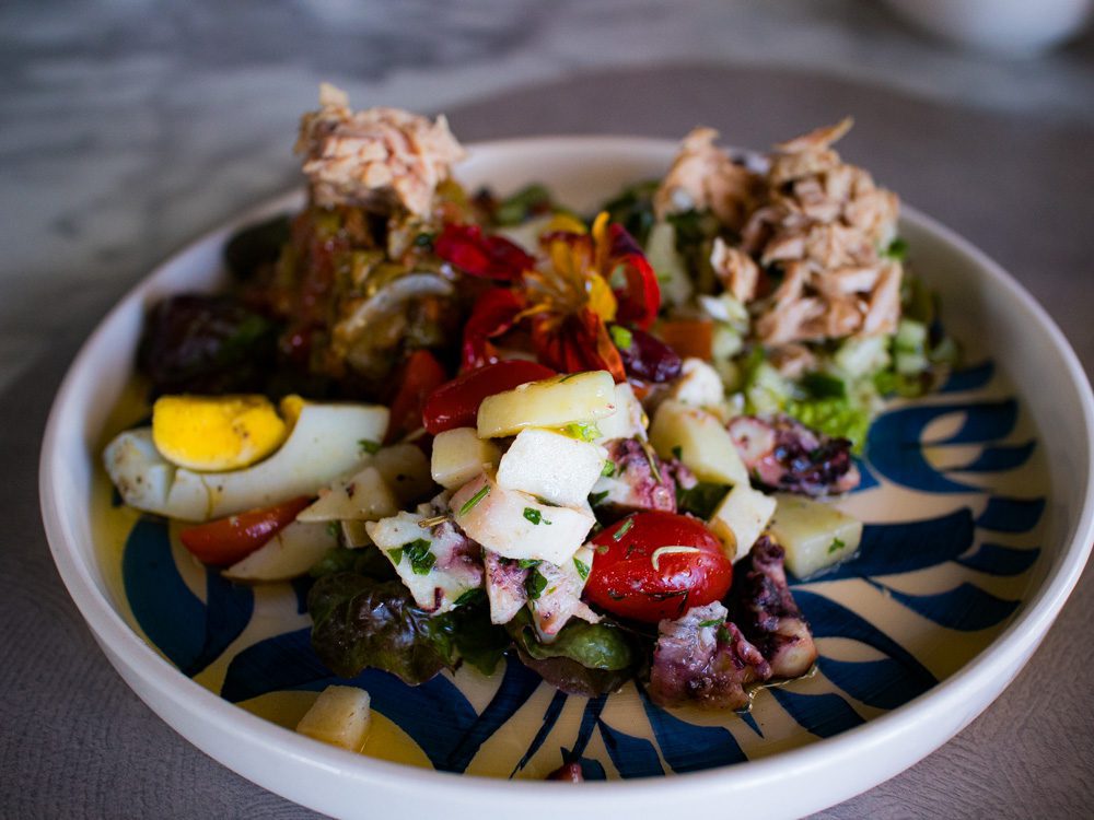 Sawa Taste Of Tunisia: Explore The Amazing Food Of Tunisia 54 Blue and white plate with salads including eggs, tuna, octopus