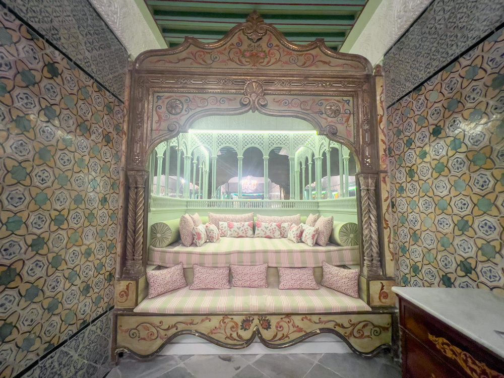 Sawa Taste Of Tunisia: Explore The Amazing Food Of Tunisia 64 One of the sofa areas upstairs at Dar Jaled tiled in greed and yellow with pink and green cushions and ornate frontage and mirrors