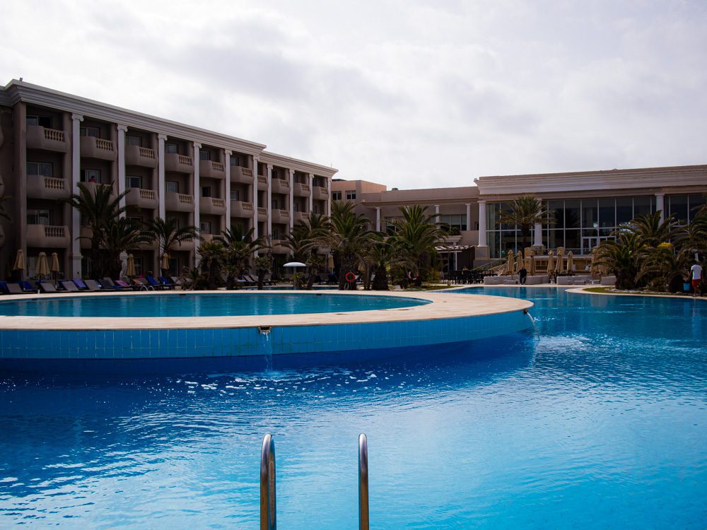 The Elegant VIP Suites at The Royal Thalassa Monastir 29 a pool with a building in the background
