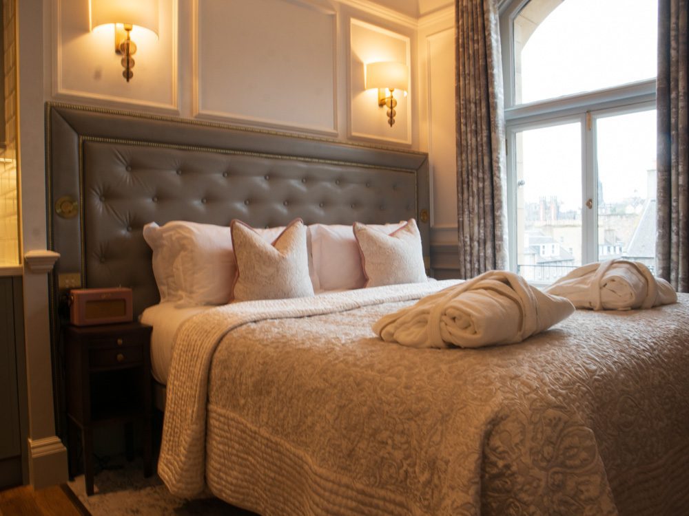 Staying at the Luxury RÌGH Residences, Edinburgh (2024) 6 The king-sized bed with leather padded headboard