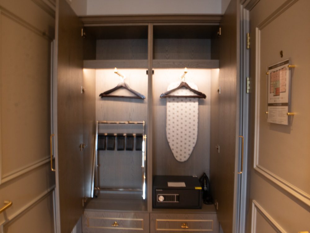 Staying at the Luxury RÌGH Residences, Edinburgh (2024) 17 The wardrobe area with coat hangers, ironing board, safe