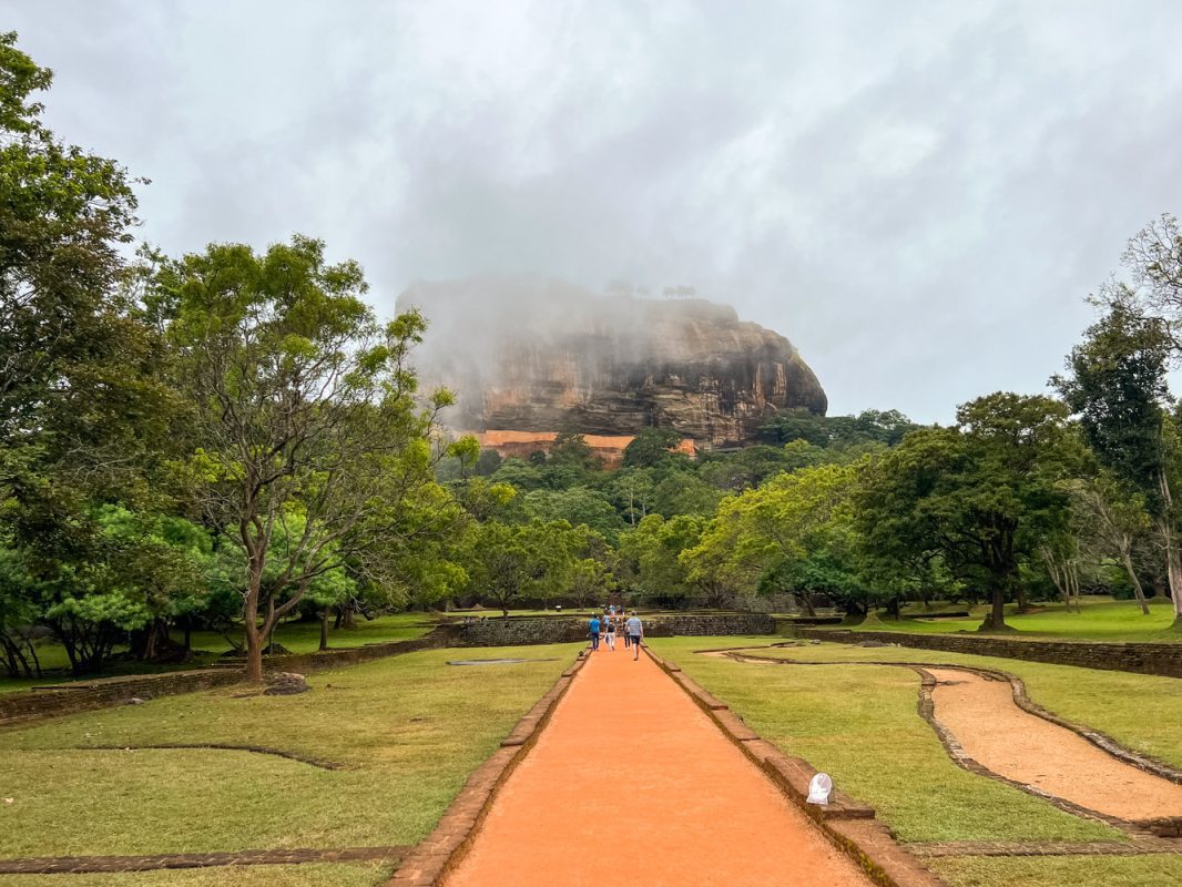Climbing The Amazing Lion Rock In Sigiriya: The Ultimate Guide (2025) 7 The red cinder path through the gardens at Lion Rock, Sigiriya