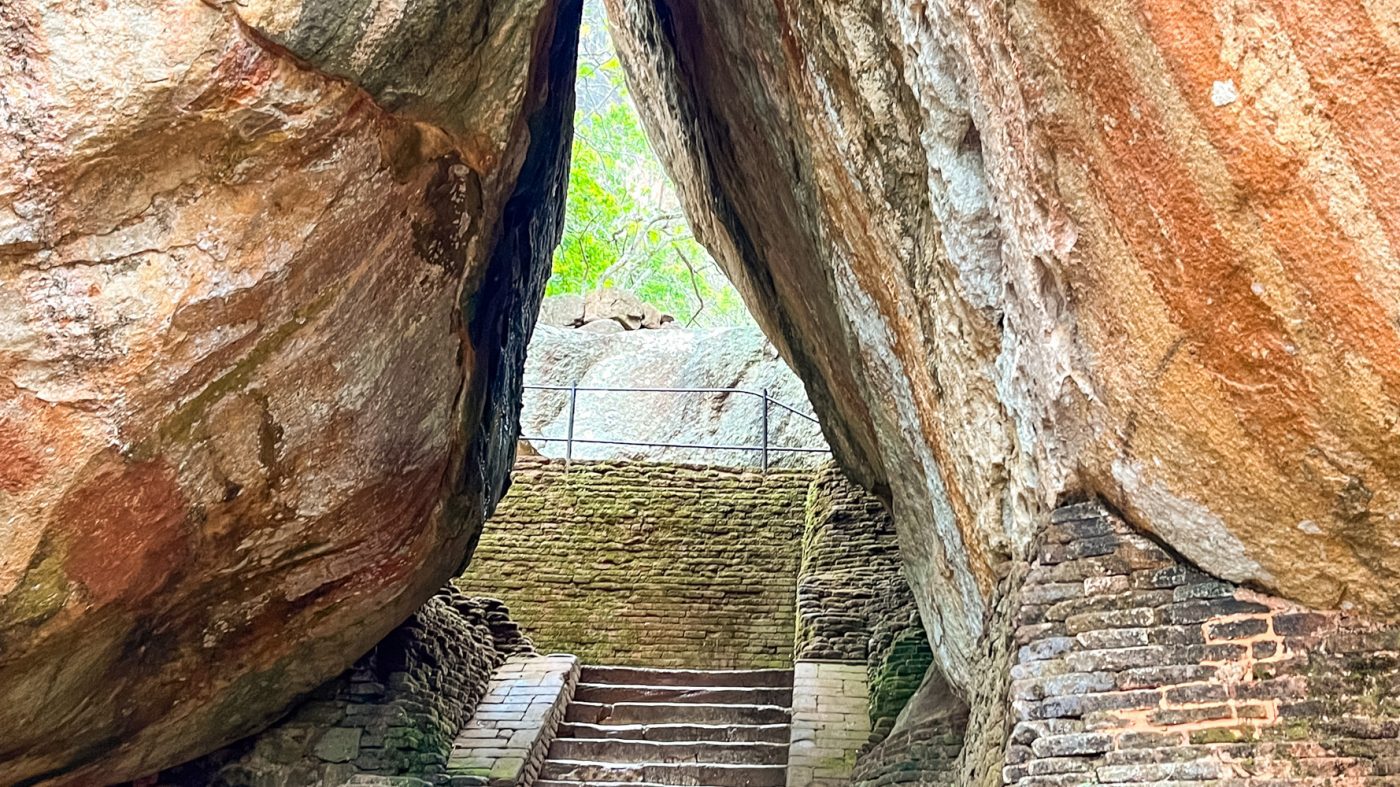 Climbing The Amazing Lion Rock In Sigiriya: The Ultimate Guide (2025) 9 The Boulder Arch two boulders leaning in to each other with steps going up between them