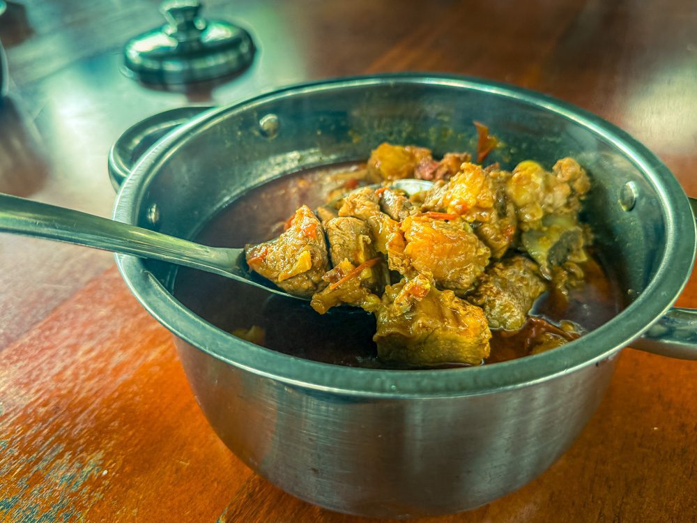 What to Eat in Uganda: A Delicious Journey Through Uganda’s Best Dishes 3 Fresh Beef Stew in a silver metal dish with spoon