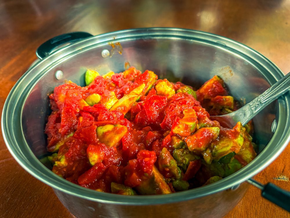 What to Eat in Uganda: A Delicious Journey Through Uganda’s Best Dishes 14 Avocado and Tomato Salsa in a silver metal dish with spoon