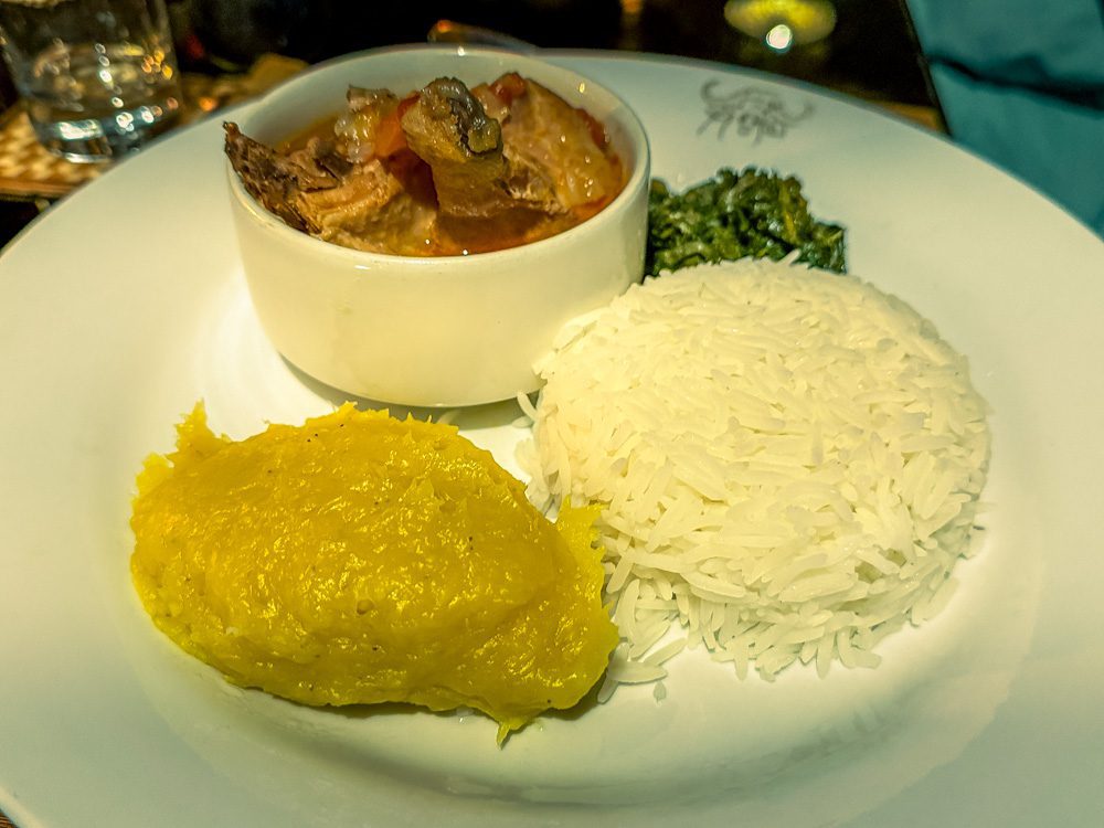 What to Eat in Uganda: A Delicious Journey Through Uganda’s Best Dishes 2 Plate of matooke and rice with meat stew and greens