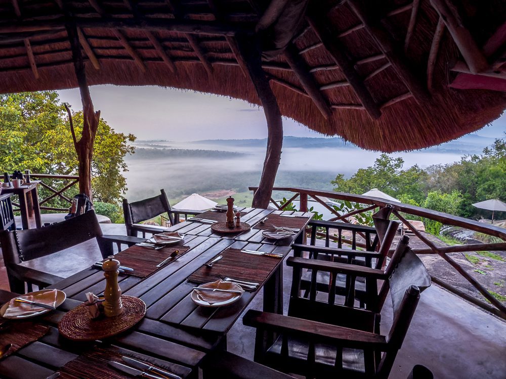 Table set for dinner with stunning views over the misty valley