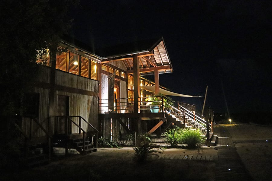 Luxury And Peace: Review Of Barbuda Belle Resort In Barbuda 16 A wooden dock over some waterDescription automatically generated