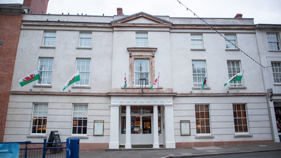 A Luxury Stay At The Angel Hotel, Abergavenny (2021) 3 White Georgian facade of Angel Hotel with pillared entrance