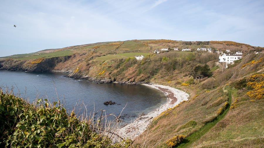 20+ Of The Best Things To Do In Port St Mary, Isle Of Man 12 white pebble beach with green hill behind