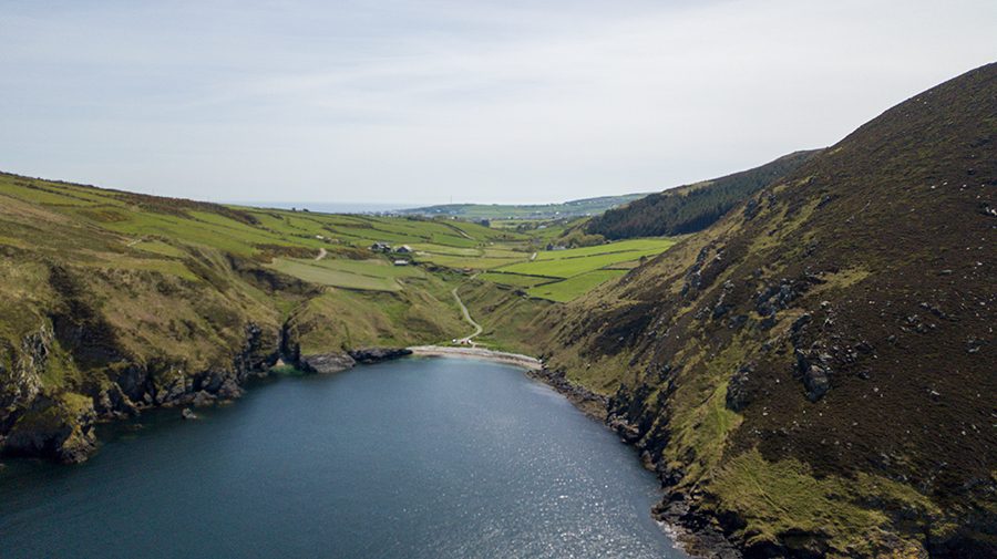20+ Of The Best Things To Do In Port Erin, Isle Of Man 15 Fleshwick Bay viewed from the air showing green pastures and over to the bay at Port St Mary