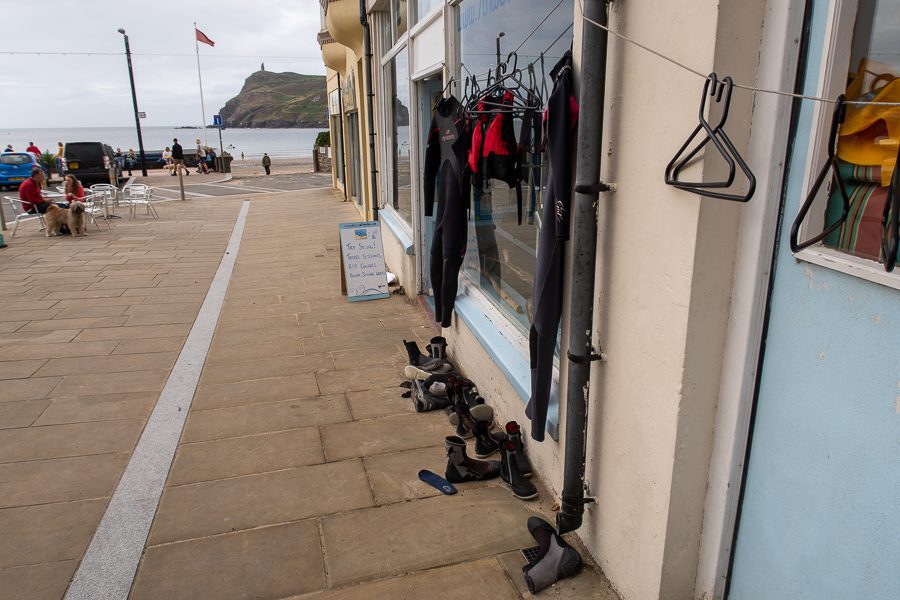 20+ Of The Best Things To Do In Port Erin, Isle Of Man 4 The outside of 7th Wave in Port Erin with Wetsuits hanging up