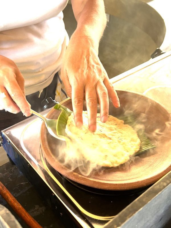 The Best Food In Sri Lanka To Eat (Including 5 Easy Recipes!) 17 flipping the roti in the pan using fingers to hold the roti