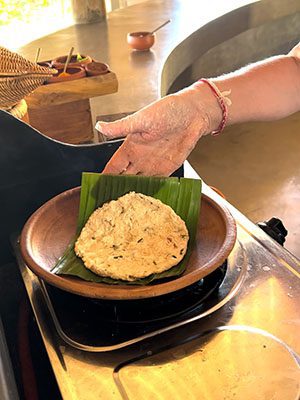 The Best Food In Sri Lanka To Eat (Including 5 Easy Recipes!) 18 the finished roti placed on a banana leaf on a clay plate